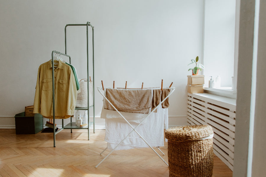 Laundry on a drying rack in a room
